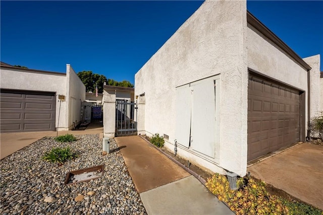 view of property exterior featuring a garage