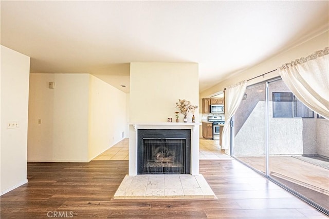 unfurnished living room with wood-type flooring