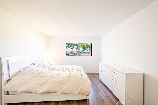 bedroom featuring dark hardwood / wood-style floors