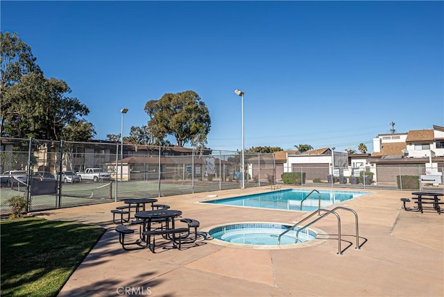 view of pool with a community hot tub