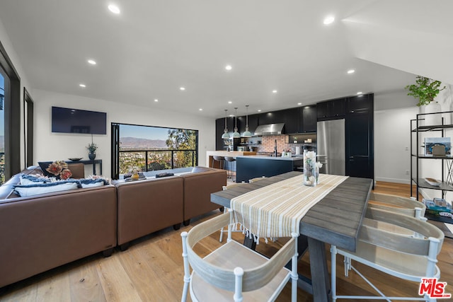 dining space featuring light hardwood / wood-style floors