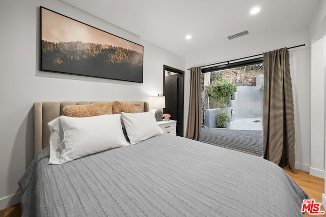 bedroom with light wood-type flooring