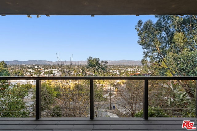 balcony featuring a mountain view