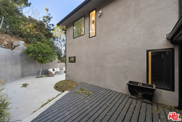 wooden deck featuring a patio area