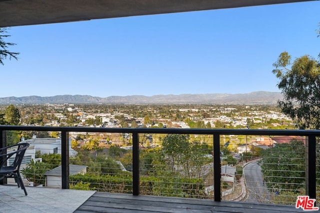 balcony featuring a mountain view