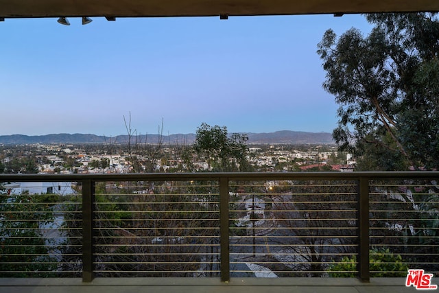 balcony featuring a mountain view