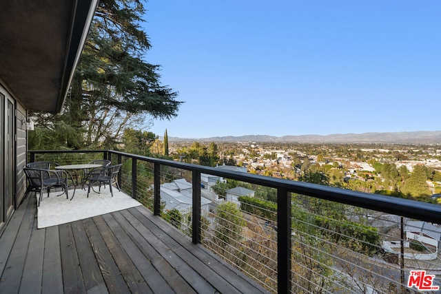 wooden deck featuring a mountain view