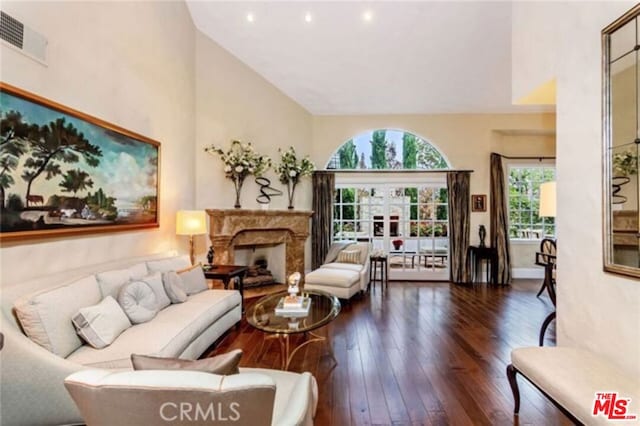 interior space featuring dark wood-type flooring and a premium fireplace