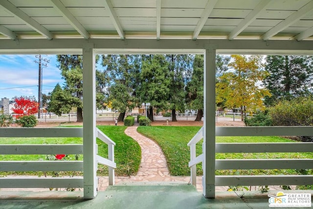 exterior space featuring beam ceiling