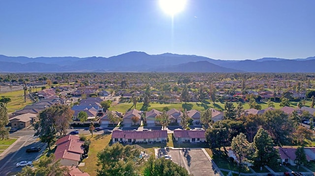 birds eye view of property featuring a mountain view