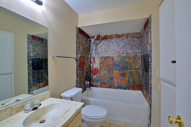 full bathroom featuring toilet, tiled shower / bath combo, tile patterned floors, and vanity