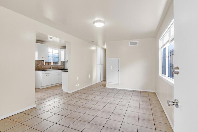 empty room with light tile patterned floors