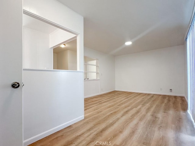 unfurnished room with light hardwood / wood-style flooring