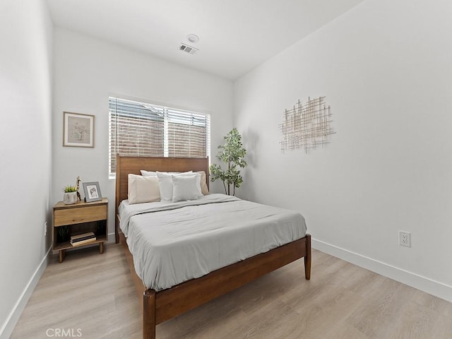 bedroom with light hardwood / wood-style flooring