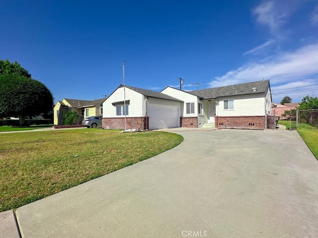 single story home featuring a front lawn and a garage