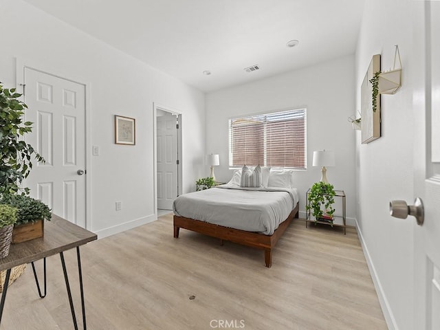 bedroom with light wood-type flooring