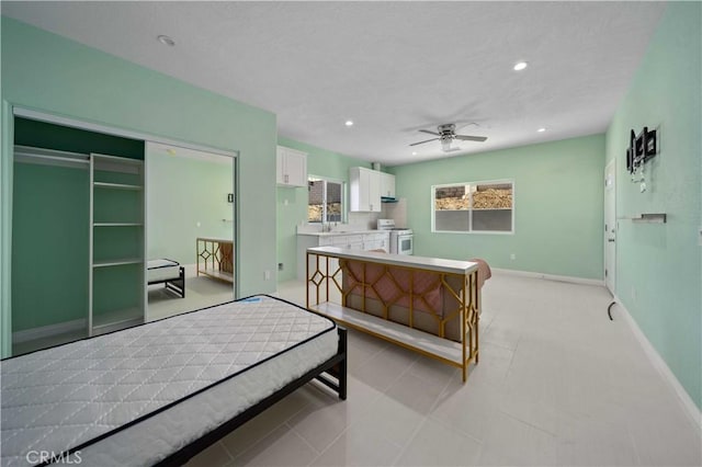 bedroom featuring ceiling fan and a closet