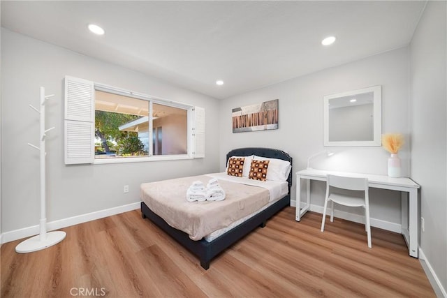 bedroom with light wood-type flooring