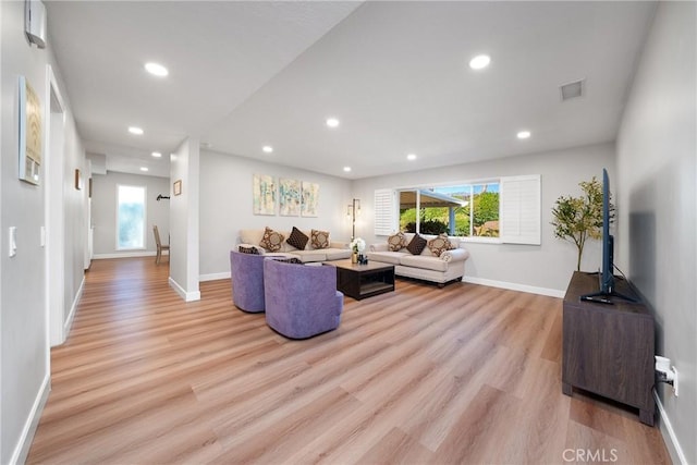 living room with light hardwood / wood-style floors