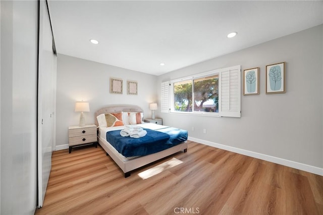 bedroom with light hardwood / wood-style flooring