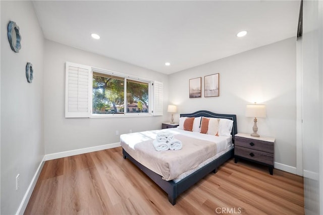 bedroom with light hardwood / wood-style flooring