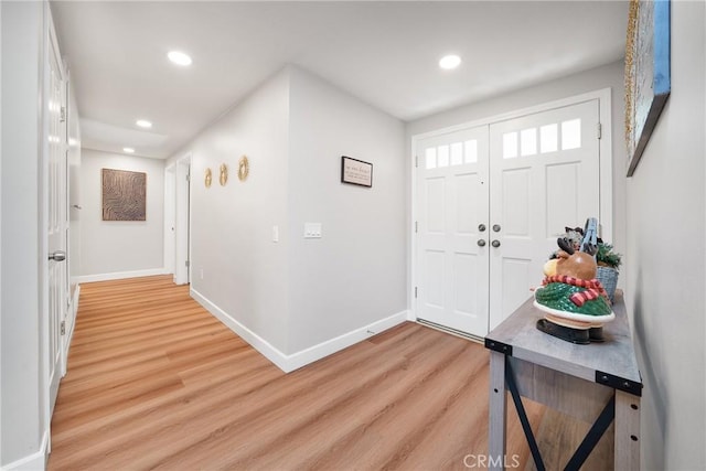 entryway with light hardwood / wood-style flooring