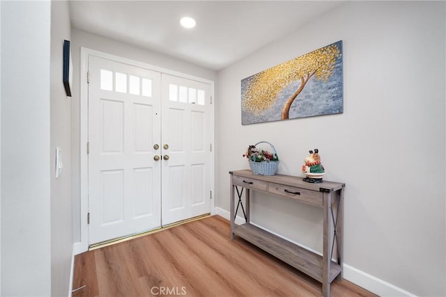 entrance foyer with hardwood / wood-style floors