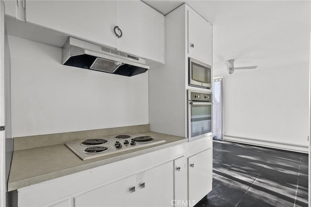 kitchen featuring ceiling fan, appliances with stainless steel finishes, white cabinetry, and a baseboard radiator