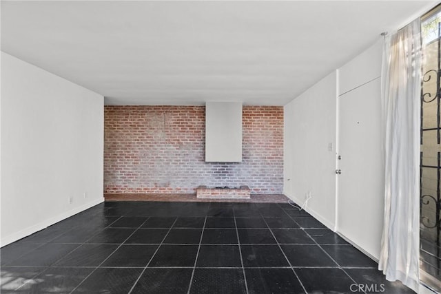 interior space featuring brick wall