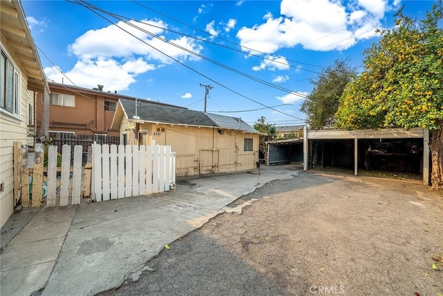 view of home's exterior featuring a carport