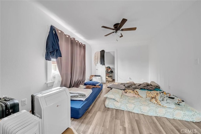 bedroom featuring ceiling fan and light wood-type flooring