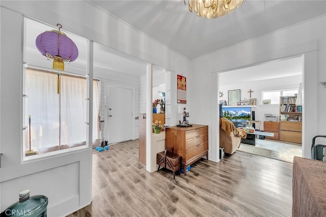 entryway with a notable chandelier and light hardwood / wood-style floors