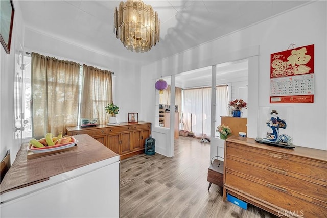 interior space with light hardwood / wood-style flooring and a chandelier