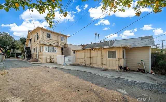 rear view of property featuring a patio