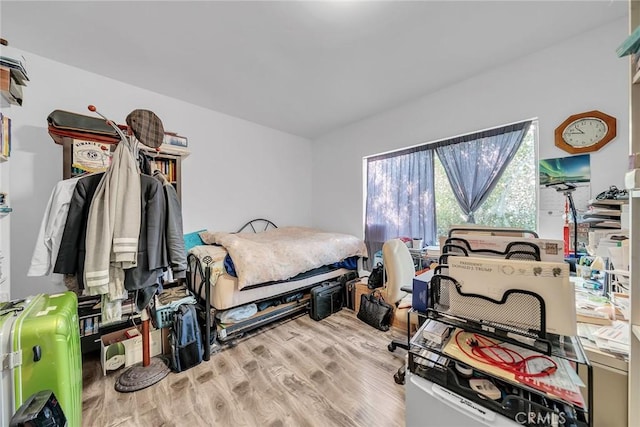 bedroom with hardwood / wood-style flooring