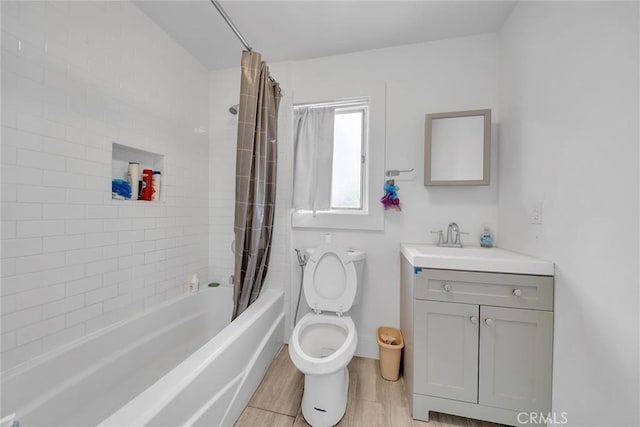 full bathroom featuring wood-type flooring, toilet, vanity, and shower / bath combination with curtain