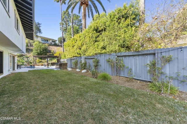 view of yard featuring a pool and a pergola