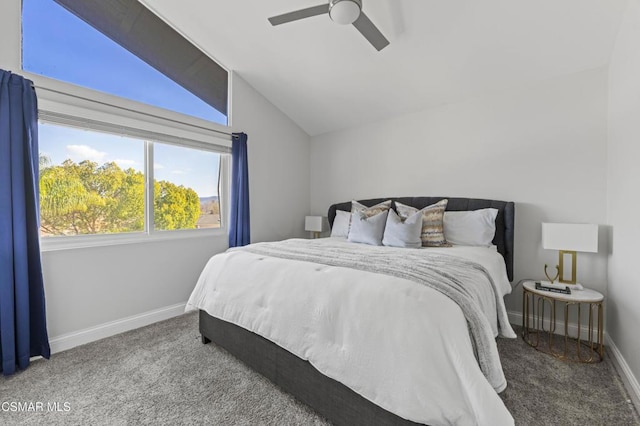 bedroom featuring ceiling fan, vaulted ceiling, and carpet floors