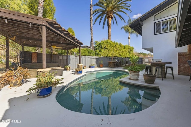 view of pool with a patio and exterior bar