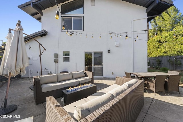 rear view of house featuring outdoor lounge area and a patio