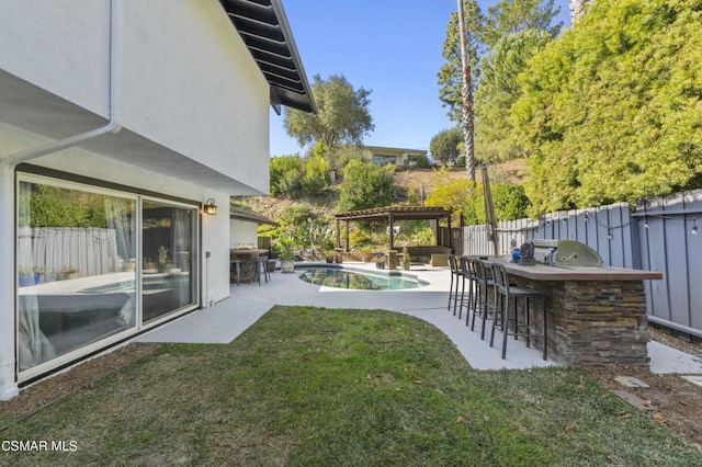 view of yard with an outdoor bar, a fenced in pool, a patio, and a pergola