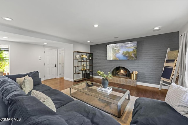 living room with a fireplace and hardwood / wood-style flooring