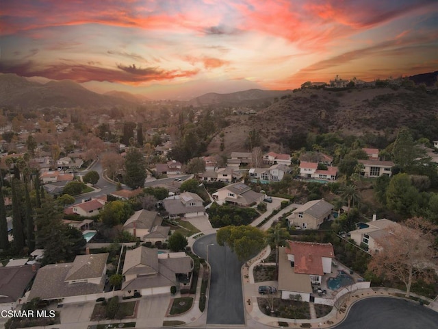 aerial view at dusk with a mountain view