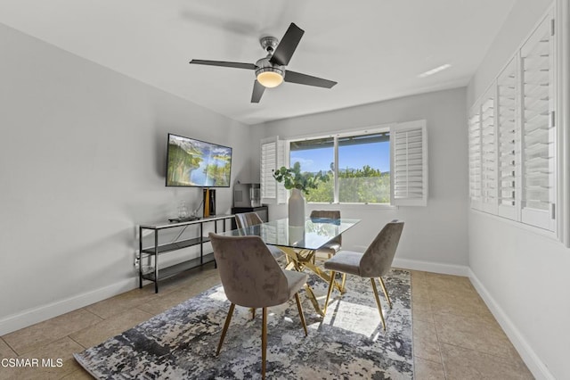 tiled dining room featuring ceiling fan