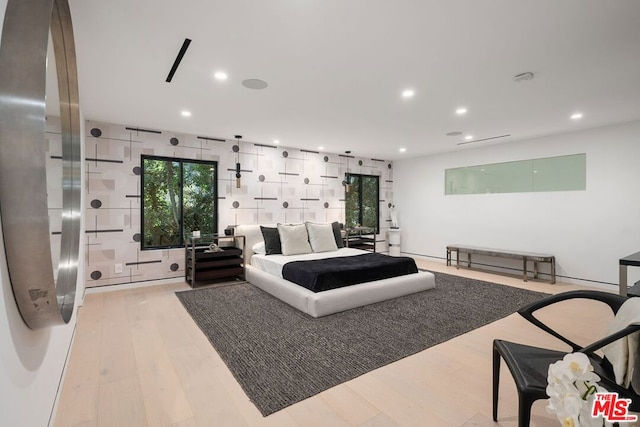 bedroom with light hardwood / wood-style flooring