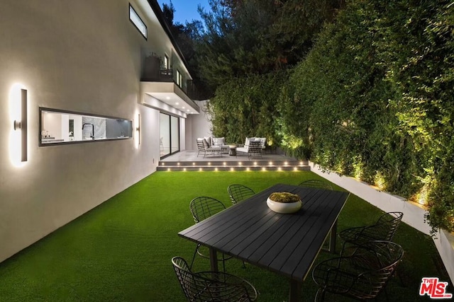 view of yard featuring an outdoor hangout area and sink