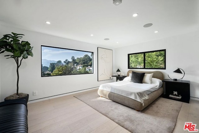 bedroom with light wood-type flooring