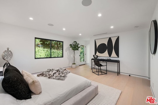 bedroom with light hardwood / wood-style floors