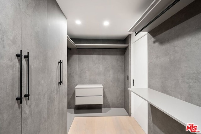 walk in closet featuring light wood-type flooring