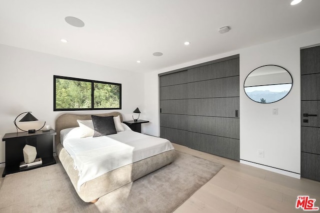 bedroom with light wood-type flooring